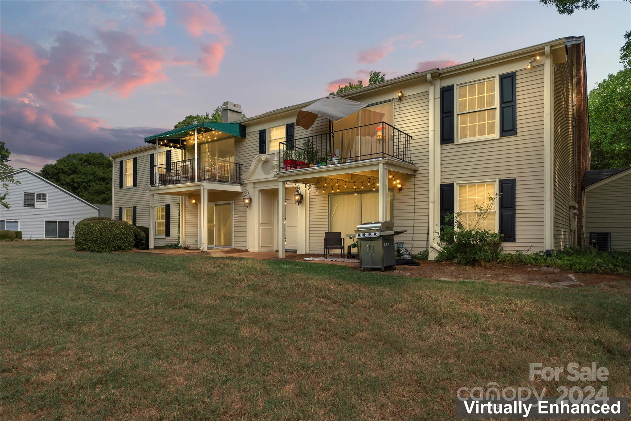 7035 Quail Hill Road Charlotte, NC 28210 - Photo 30 of 40 front view of a house with a garden