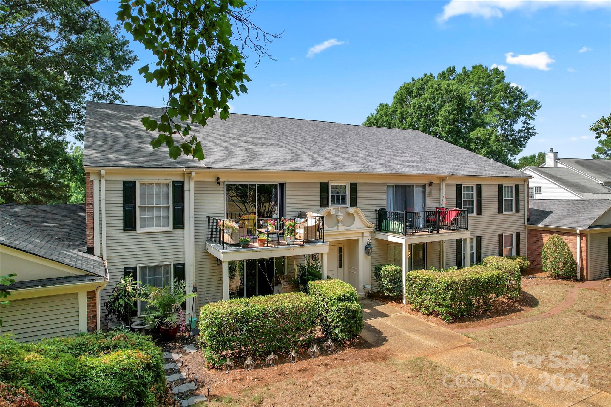 7035 Quail Hill Road Charlotte, NC 28210 - Photo 34 of 40 a front view of a house with yard and green space