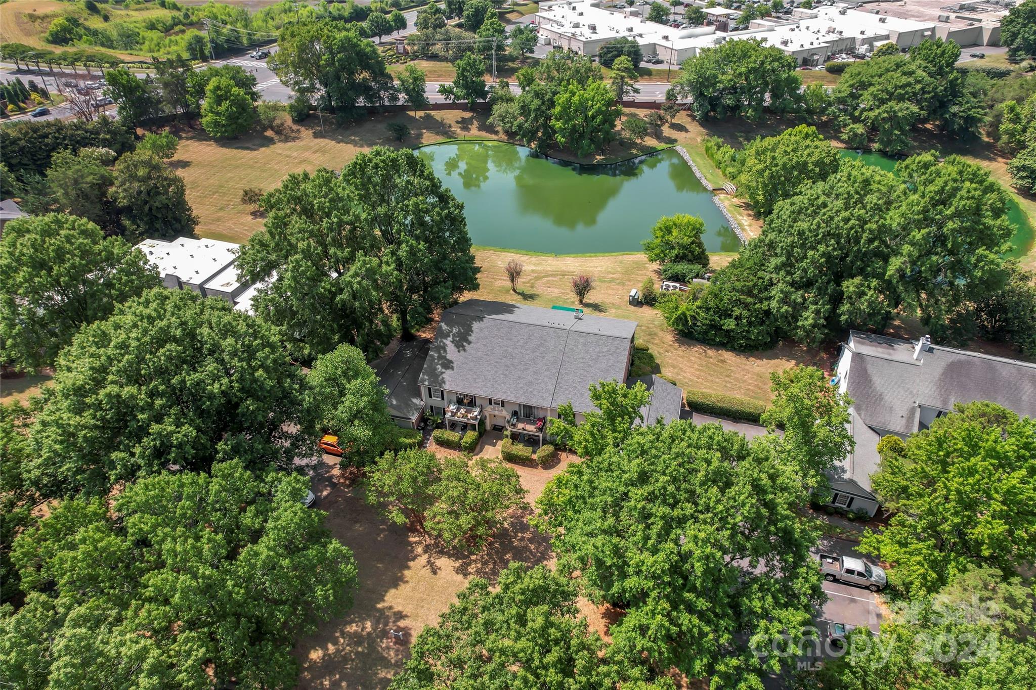 7035 Quail Hill Road Charlotte, NC 28210 - Photo 38 of 40 an aerial view of a house with a lake view