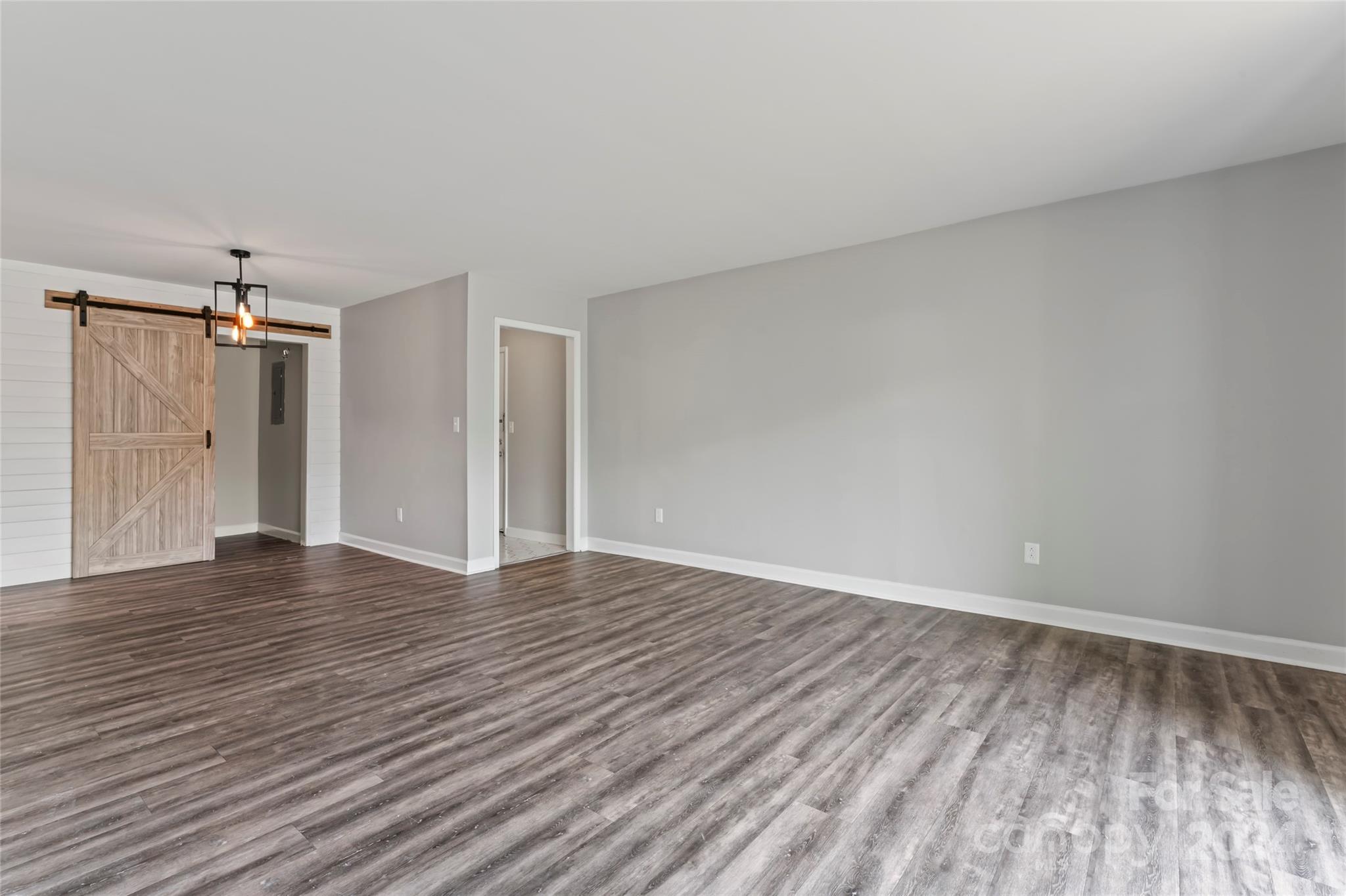 7035 Quail Hill Road Charlotte, NC 28210 - Photo 8 of 40 a view of an empty room with wooden floor