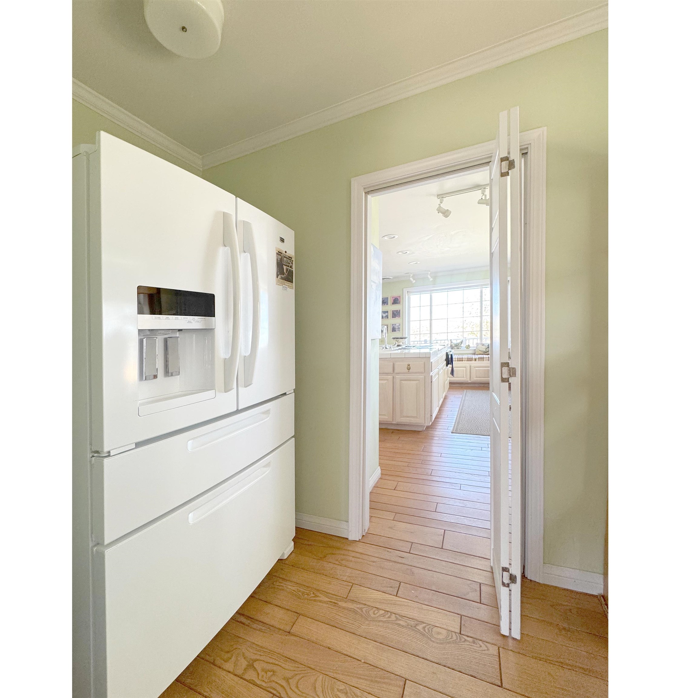 416 Wilson Creek Road Lee Vining, CA 93541 - Photo 23 of 64 a view of a hallway with wooden floor and a living room
