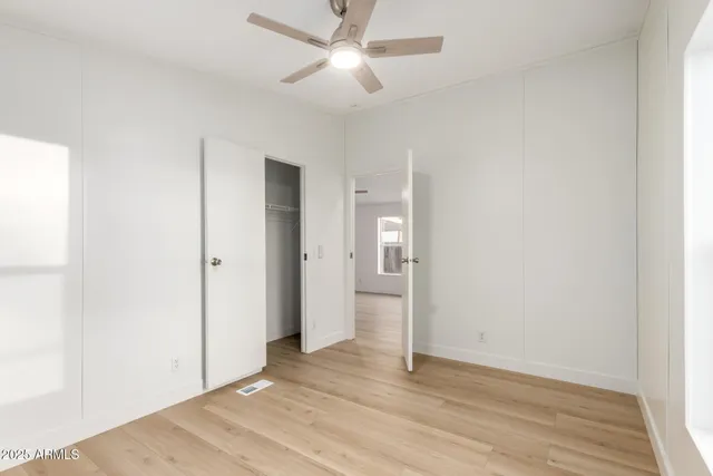 a bathroom with a sink toilet and a mirror