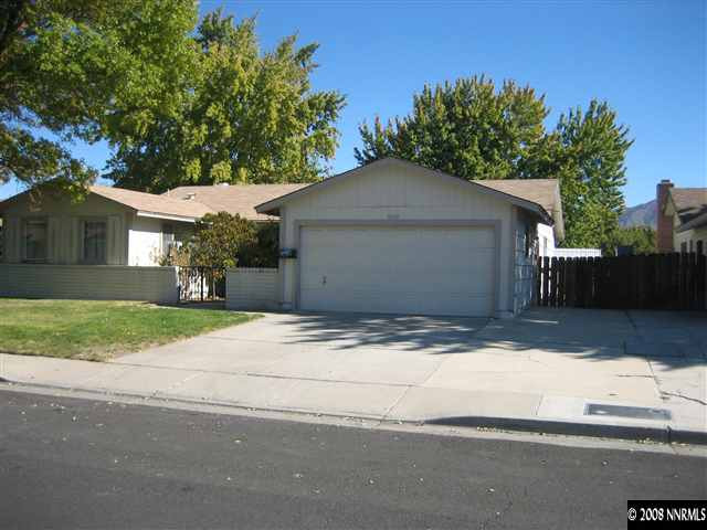 3020 Bobby Drive Reno, NV 89502 - Photo 1 of 1 a front view of a house with a yard and garage