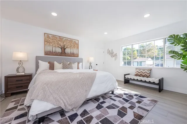 a bedroom with a bed and window