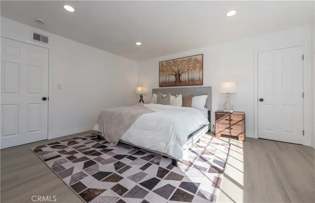 a bathroom with a sink vanity and mirror