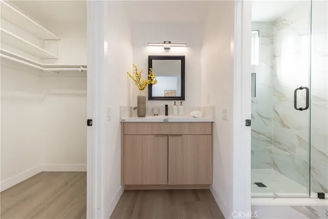 a bathroom with a shower and a sink