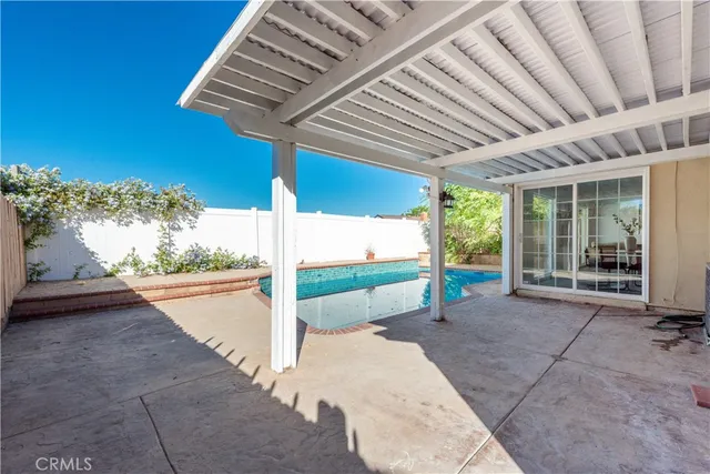 a view of swimming pool with a patio