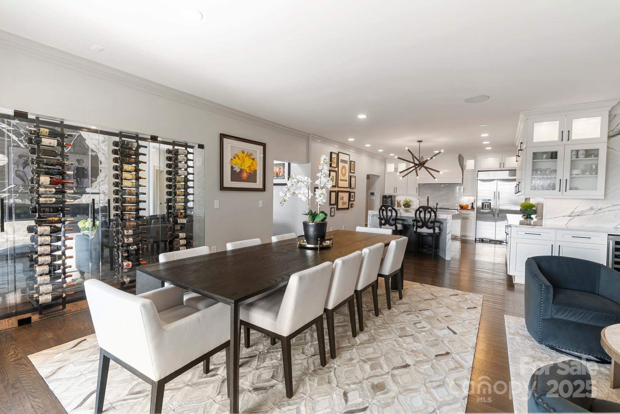 17819 John Connor Road Cornelius, NC 28031 - Photo 13 of 48 a living room with couches a coffee table and kitchen view with wooden floor