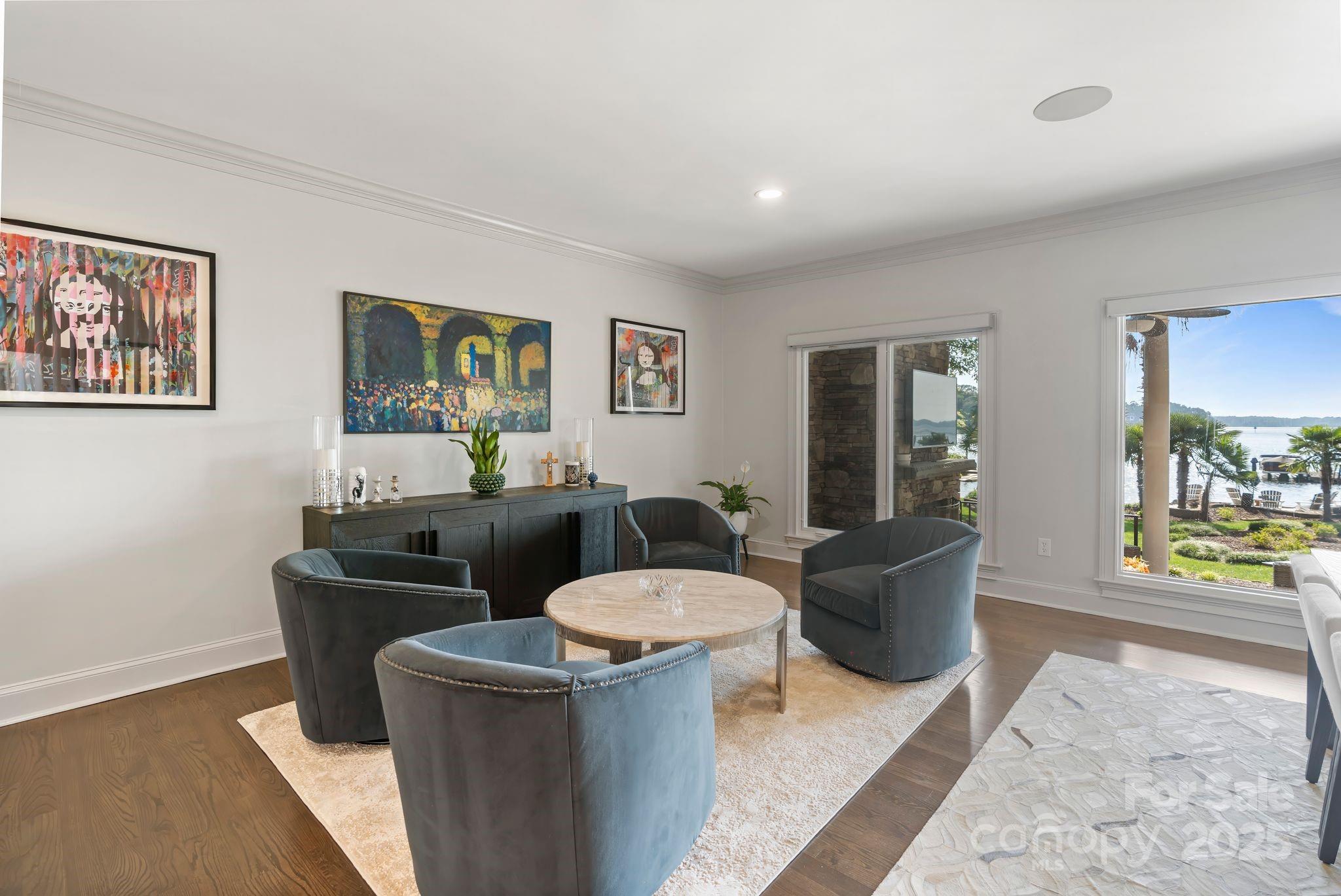 17819 John Connor Road Cornelius, NC 28031 - Photo 16 of 48 a living room with furniture and a potted plant