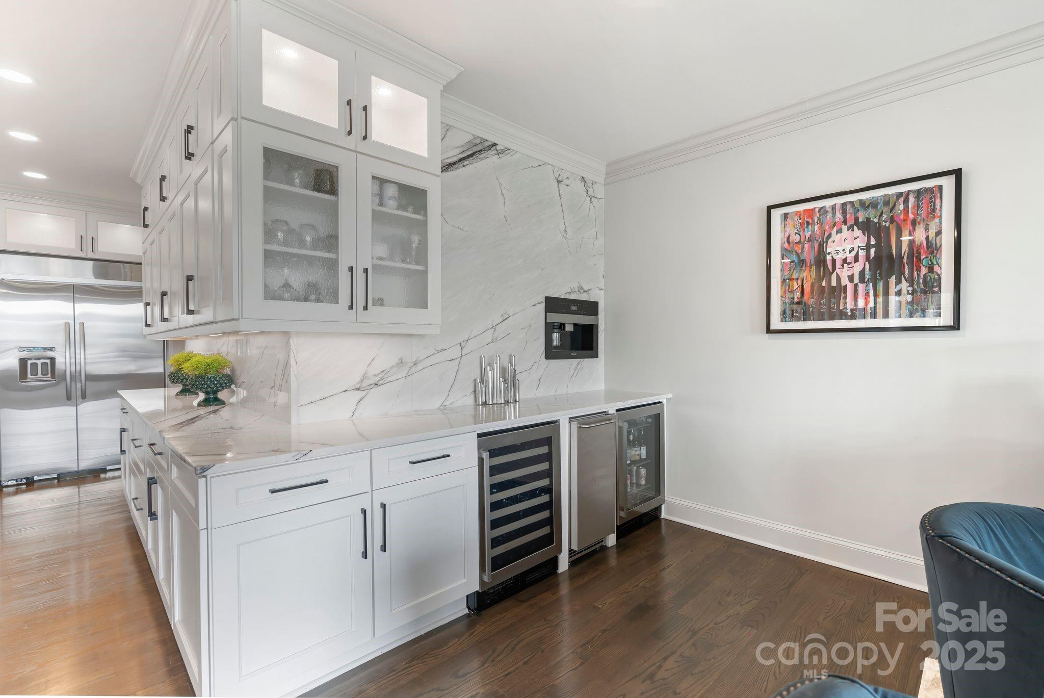 17819 John Connor Road Cornelius, NC 28031 - Photo 17 of 48 a kitchen with stainless steel appliances cabinets and wooden floor