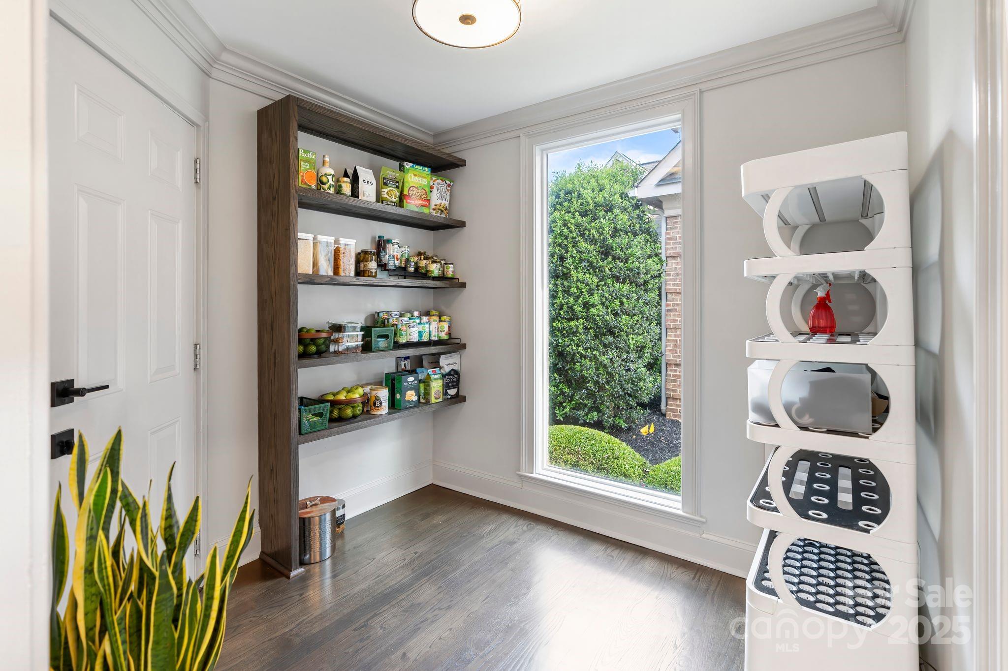 17819 John Connor Road Cornelius, NC 28031 - Photo 18 of 48 a room with a book shelf and a wooden floor