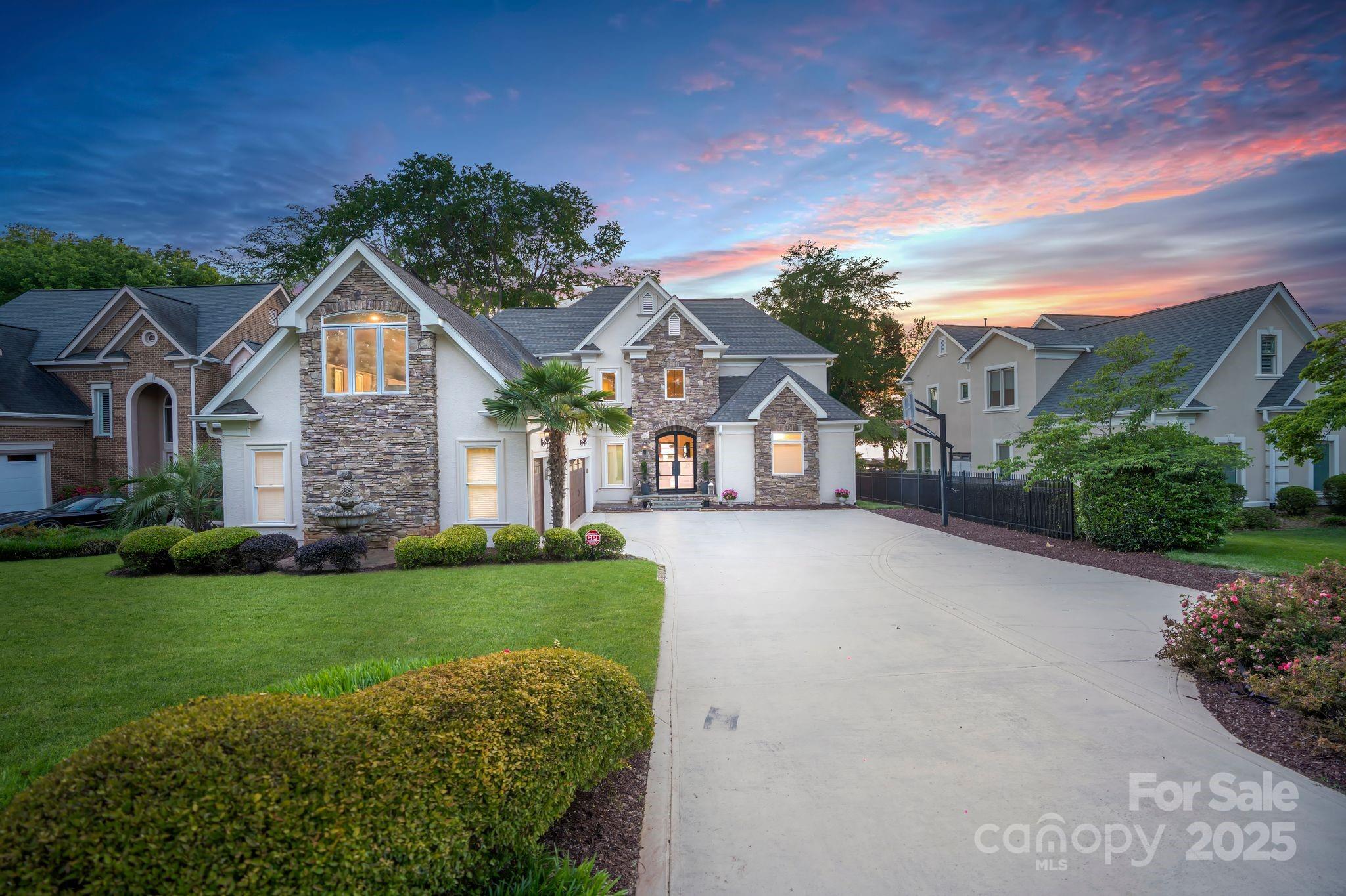 17819 John Connor Road Cornelius, NC 28031 - Photo 2 of 48 a front view of a house with a yard