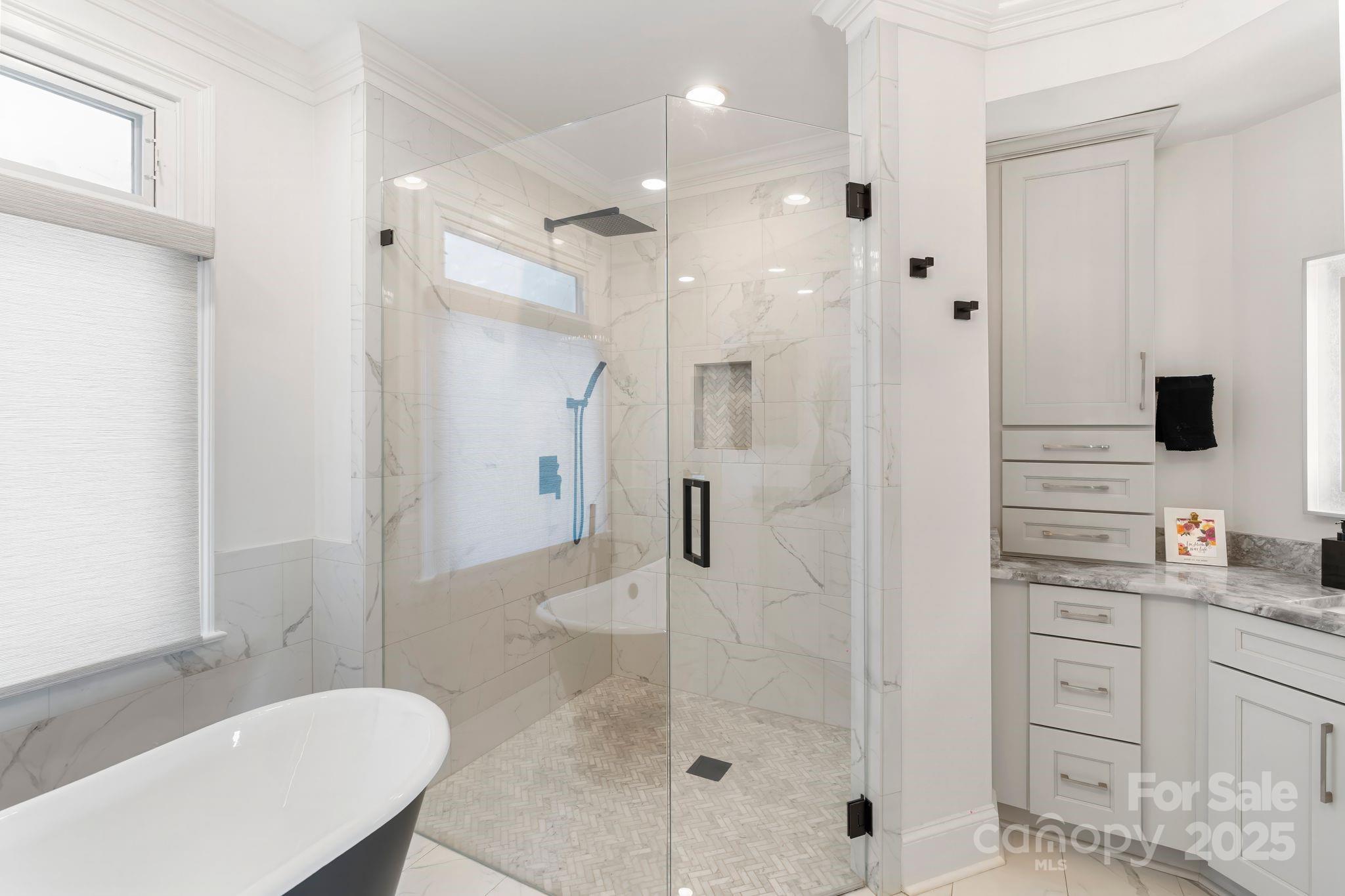 17819 John Connor Road Cornelius, NC 28031 - Photo 21 of 48 a bathroom with a granite countertop sink mirror and shower