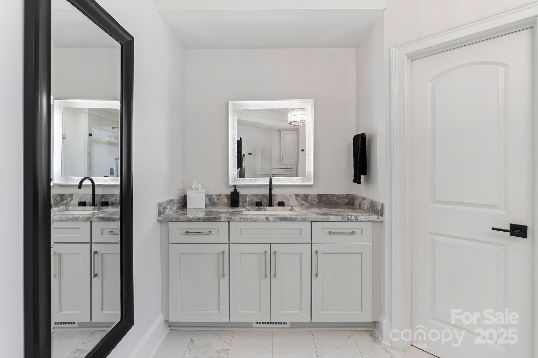 17819 John Connor Road Cornelius, NC 28031 - Photo 22 of 48 a en suite bathroom with a granite countertop sink and a mirror