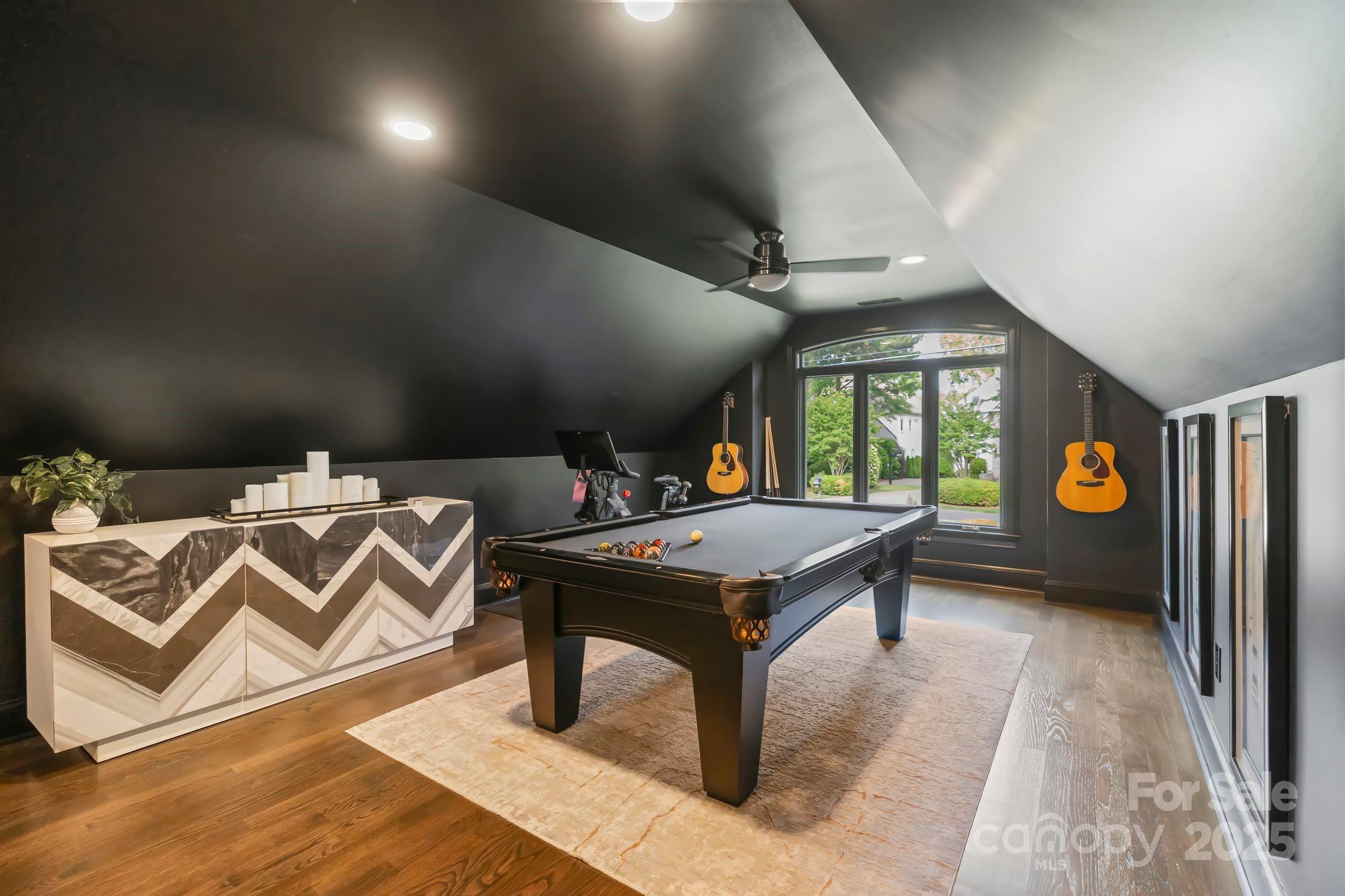 17819 John Connor Road Cornelius, NC 28031 - Photo 24 of 48 a living room with a table chairs and a wooden floor