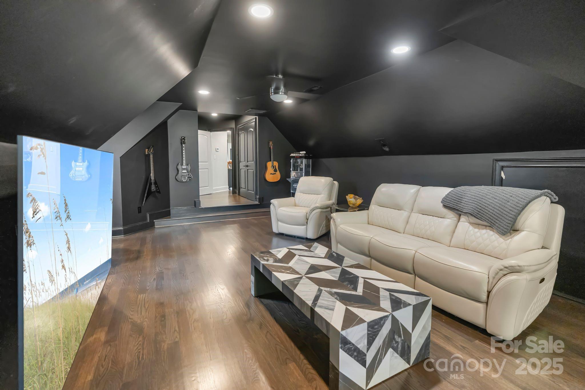 17819 John Connor Road Cornelius, NC 28031 - Photo 26 of 48 a living room with furniture and a wooden floor