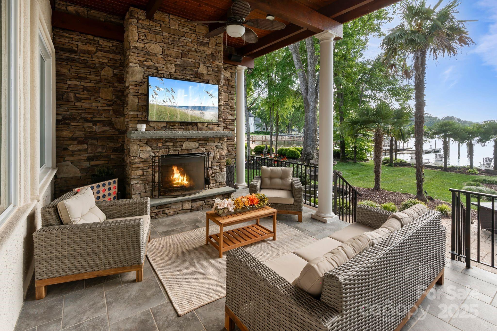 17819 John Connor Road Cornelius, NC 28031 - Photo 35 of 48 a outdoor living space with patio furniture and a fireplace