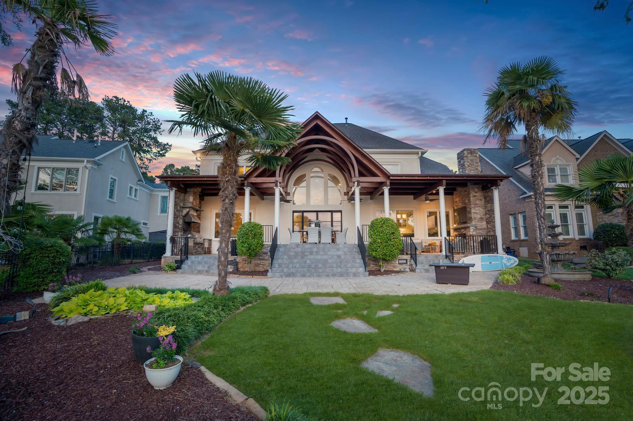 17819 John Connor Road Cornelius, NC 28031 - Photo 42 of 48 a front view of a house with garden and patio