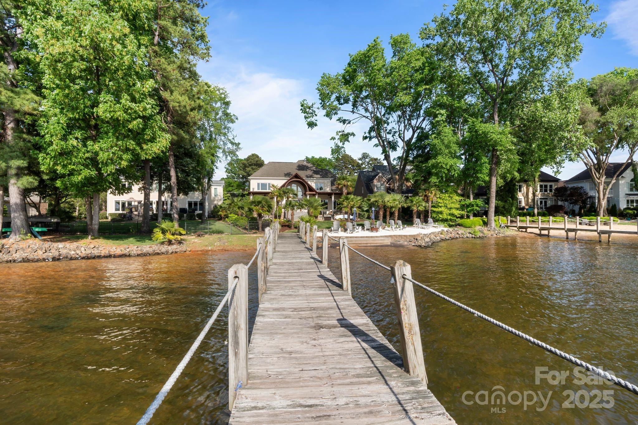 17819 John Connor Road Cornelius, NC 28031 - Photo 46 of 48 a view of swimming pool with outdoor seating and trees in the background