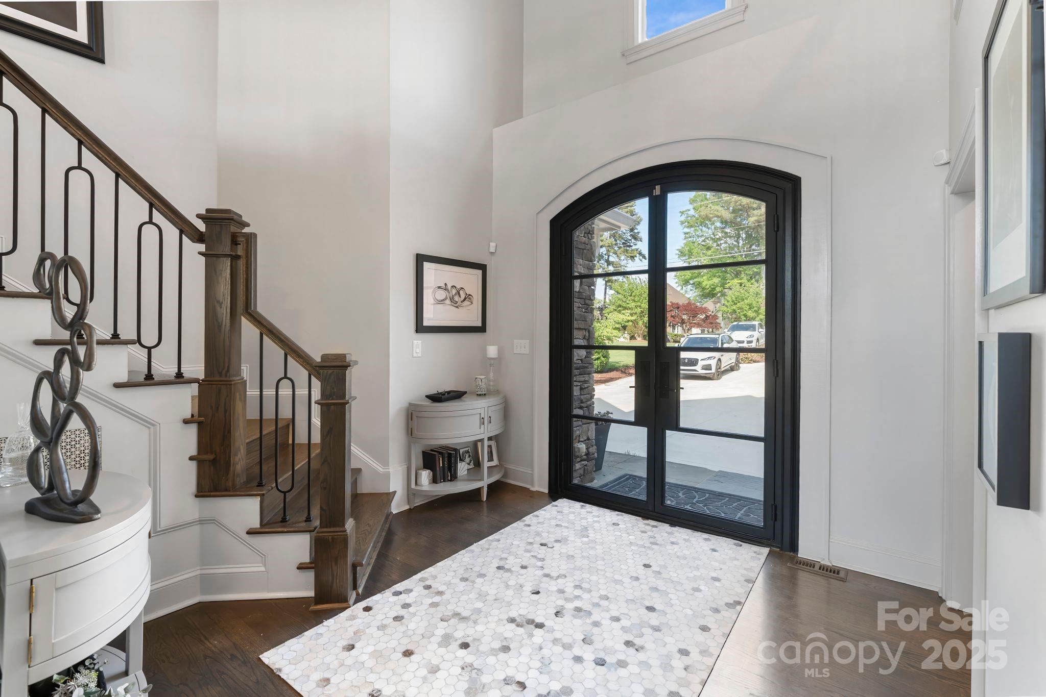 17819 John Connor Road Cornelius, NC 28031 - Photo 6 of 48 a living room with a balcony a rug and a view of bathroom