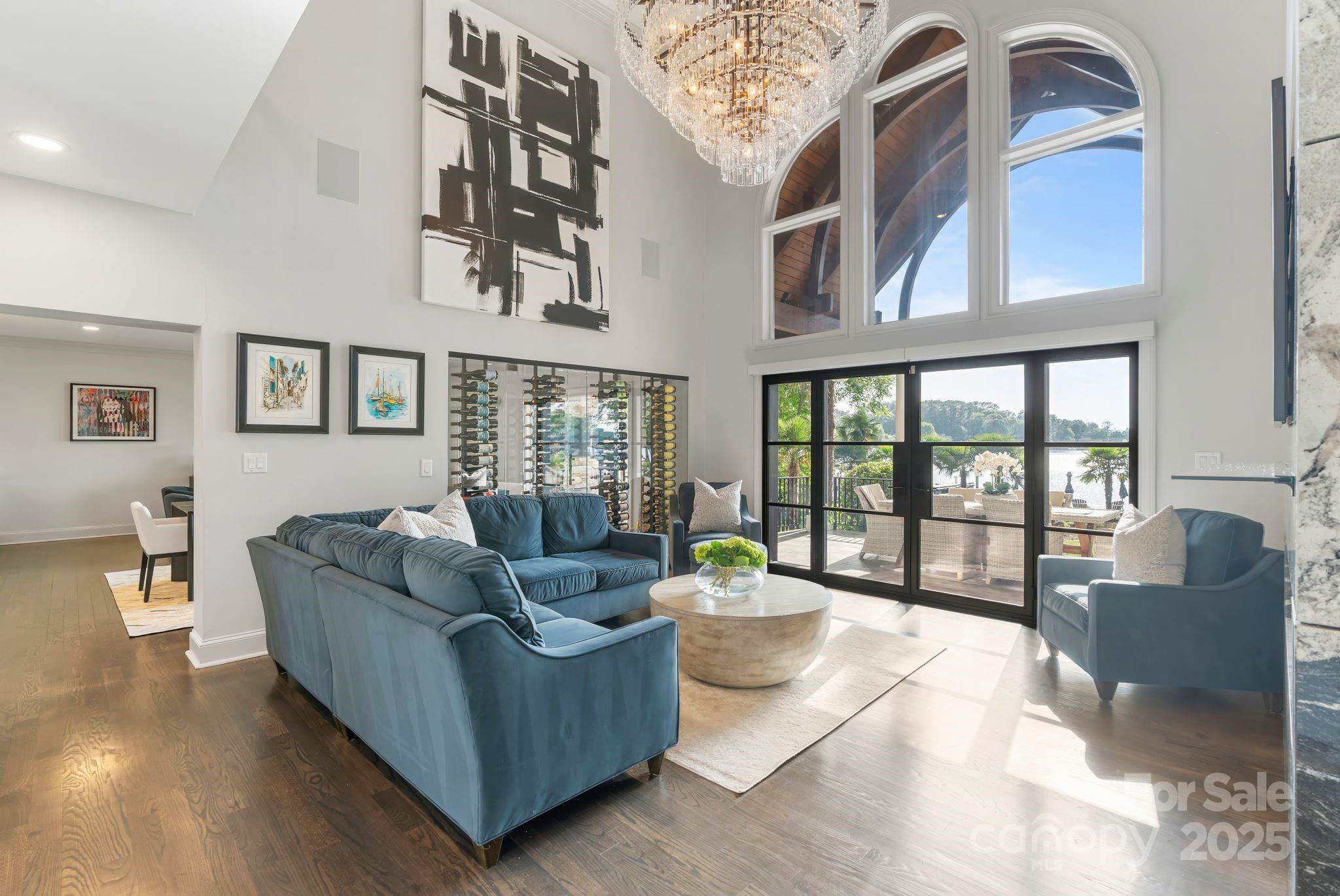 17819 John Connor Road Cornelius, NC 28031 - Photo 7 of 48 a living room with furniture and floor to ceiling windows