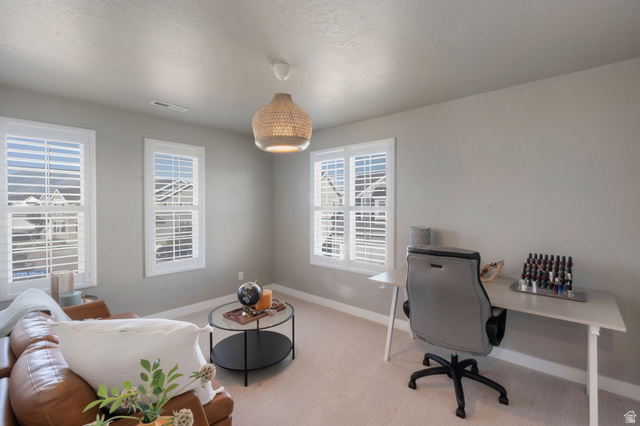 2319 North 3370 West Lehi, UT 84048 - Photo 18 of 30 Neutral tone walls with white trim, featuring three windows with white plantation shutters