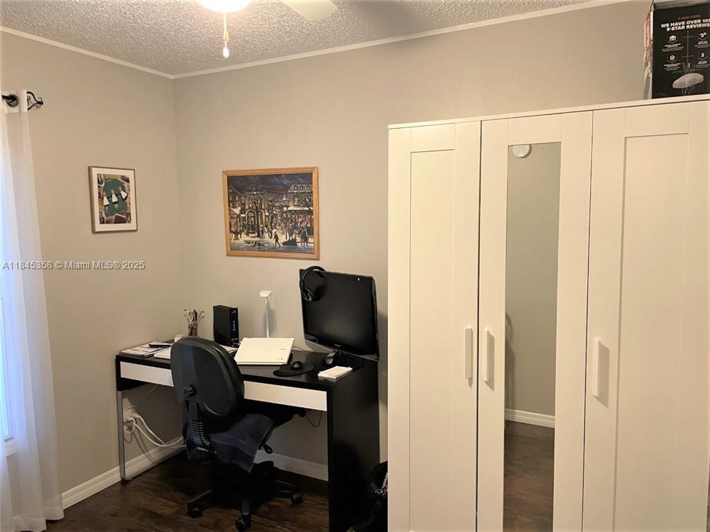 8671 Southwest 18th Place Davie, FL 33324 - Photo 11 of 22 a view of a workspace with furniture and a window