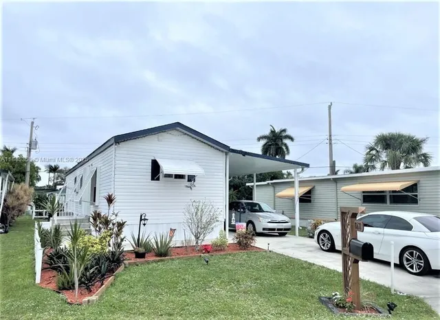 a front view of house with yard and seating area
