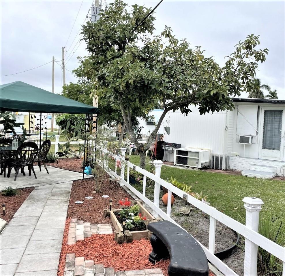 8671 Southwest 18th Place Davie, FL 33324 - Photo 19 of 22 a view of house with outdoor seating and city view