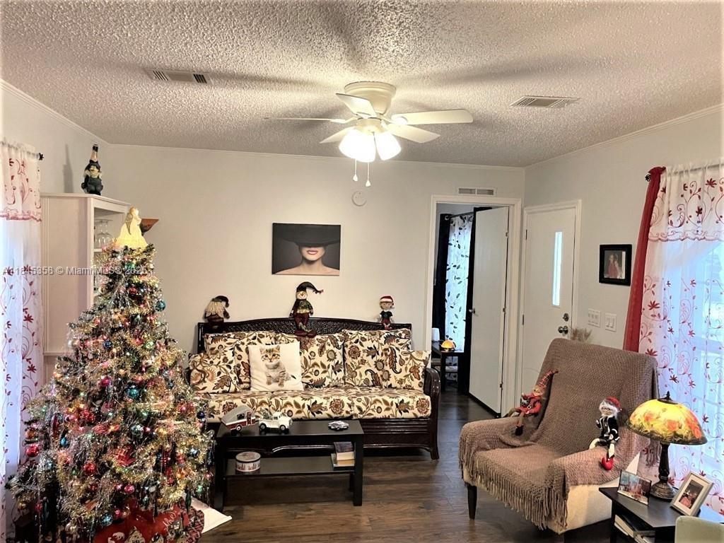 8671 Southwest 18th Place Davie, FL 33324 - Photo 6 of 22 a living room with furniture and wooden floor