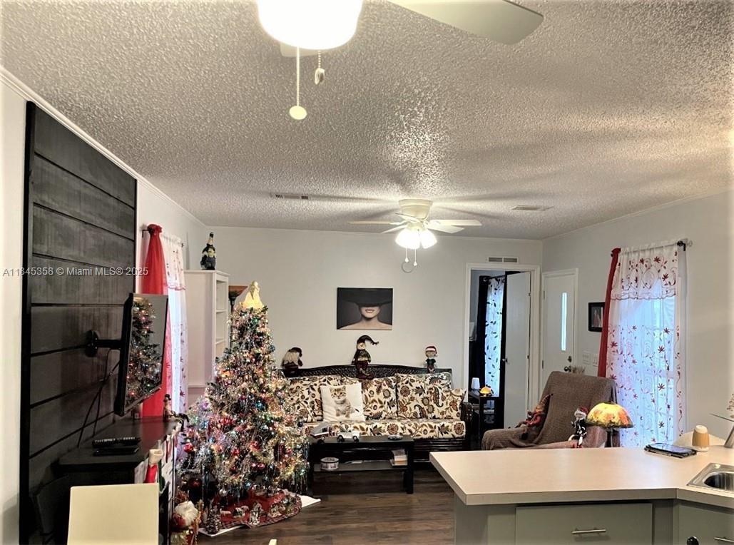 8671 Southwest 18th Place Davie, FL 33324 - Photo 8 of 22 a living room with furniture and a chandelier