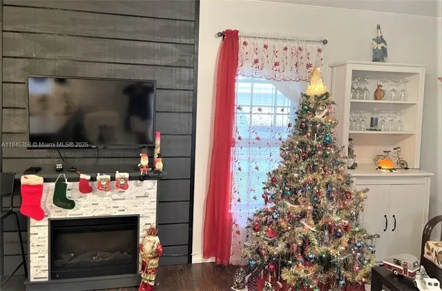 a utility room with fireplace and wooden floor