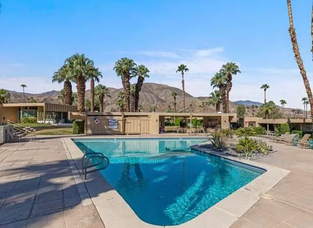 a view of a swimming pool with a patio
