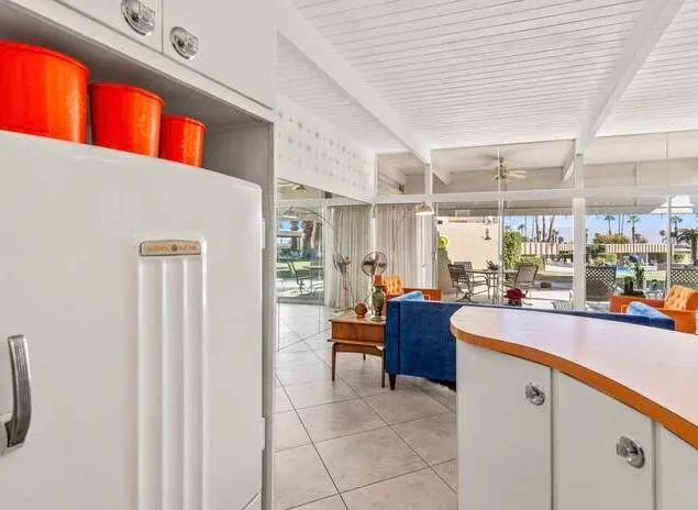 a kitchen with a sink a counter top space and appliances