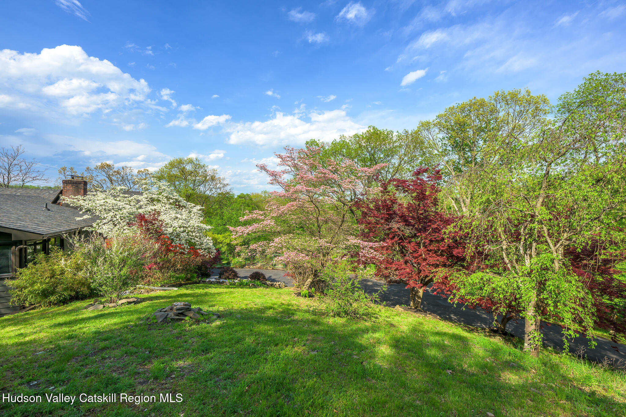 29 Edgemere Hill Road Catskill, NY 12414 - Photo 28 of 38 a view of a big yard with plants and a garden