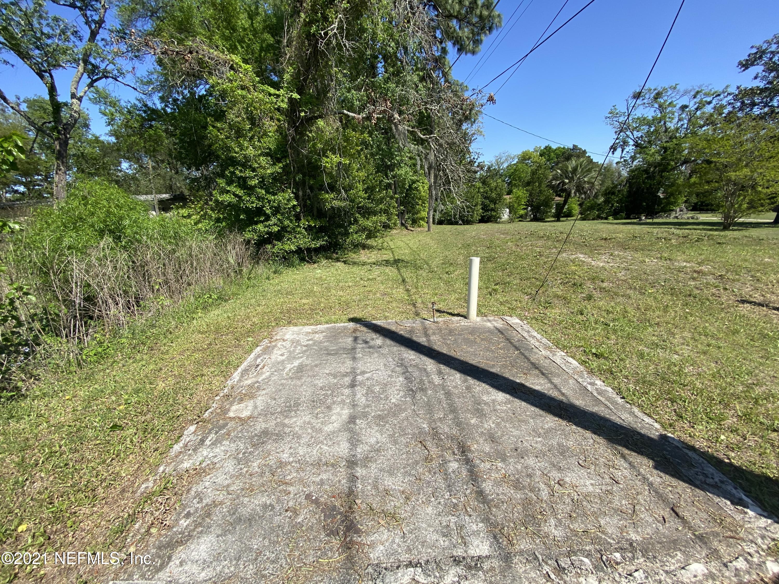 6427 Firestone Road Jacksonville, FL 32244 - Photo 11 of 55 a view of a lake with a yard