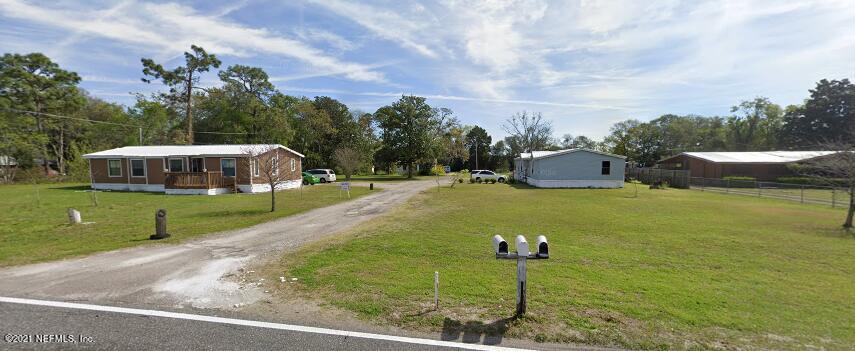 6427 Firestone Road Jacksonville, FL 32244 - Photo 2 of 55 a view of a fountain in front of a house