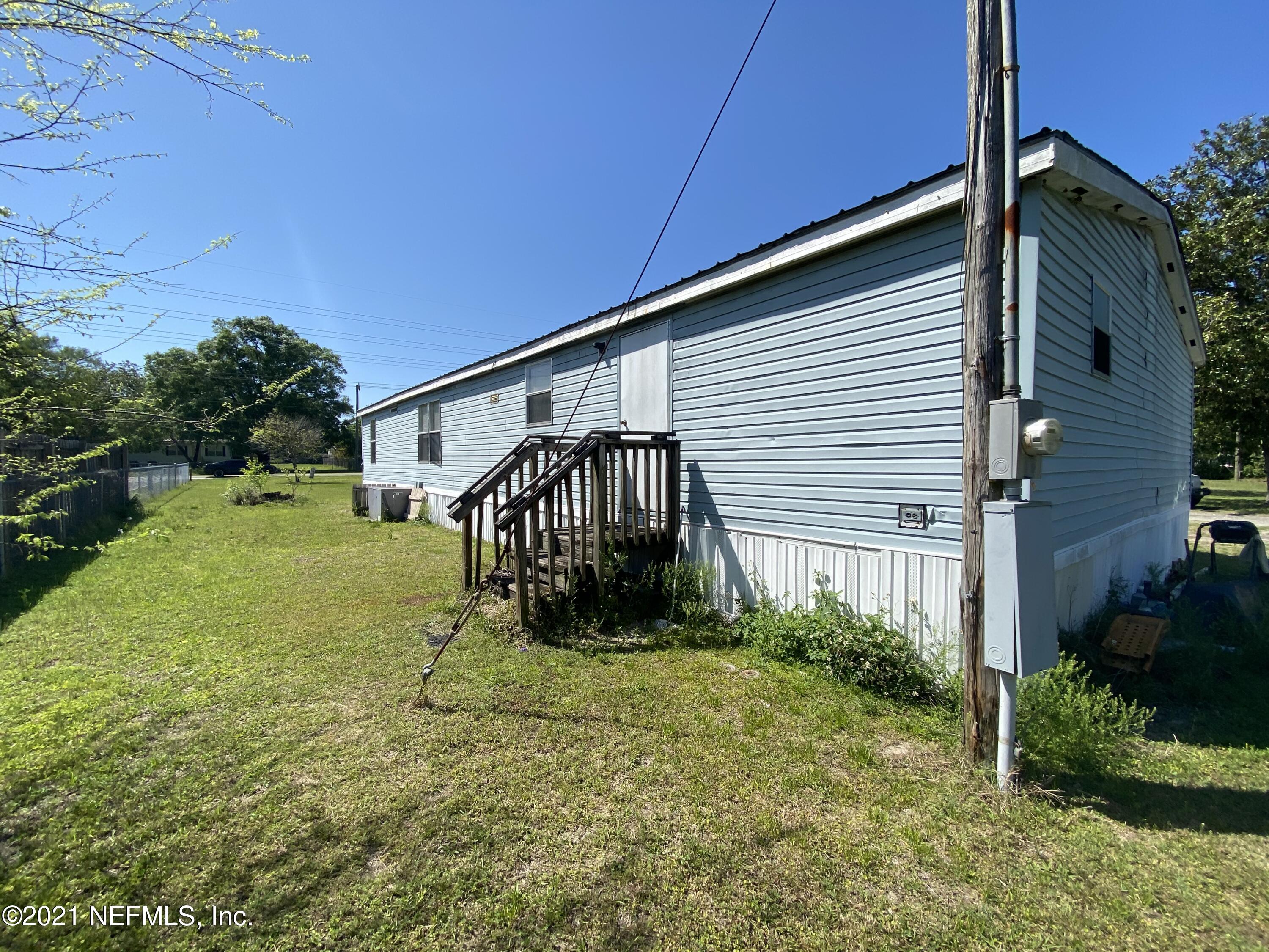 6427 Firestone Road Jacksonville, FL 32244 - Photo 27 of 55 a view of a house with backyard and garden