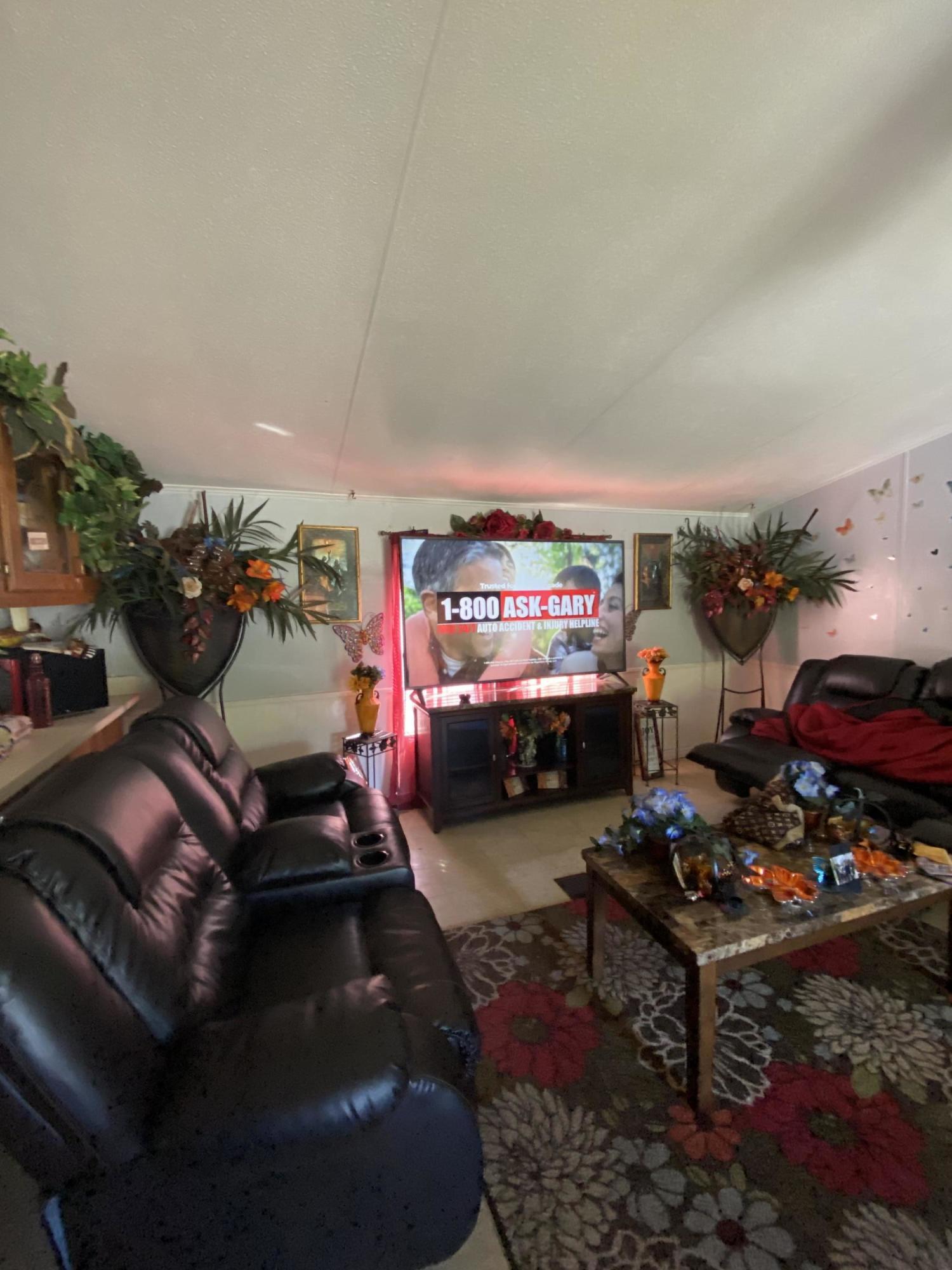 6427 Firestone Road Jacksonville, FL 32244 - Photo 35 of 55 a room with furniture a rug and a table