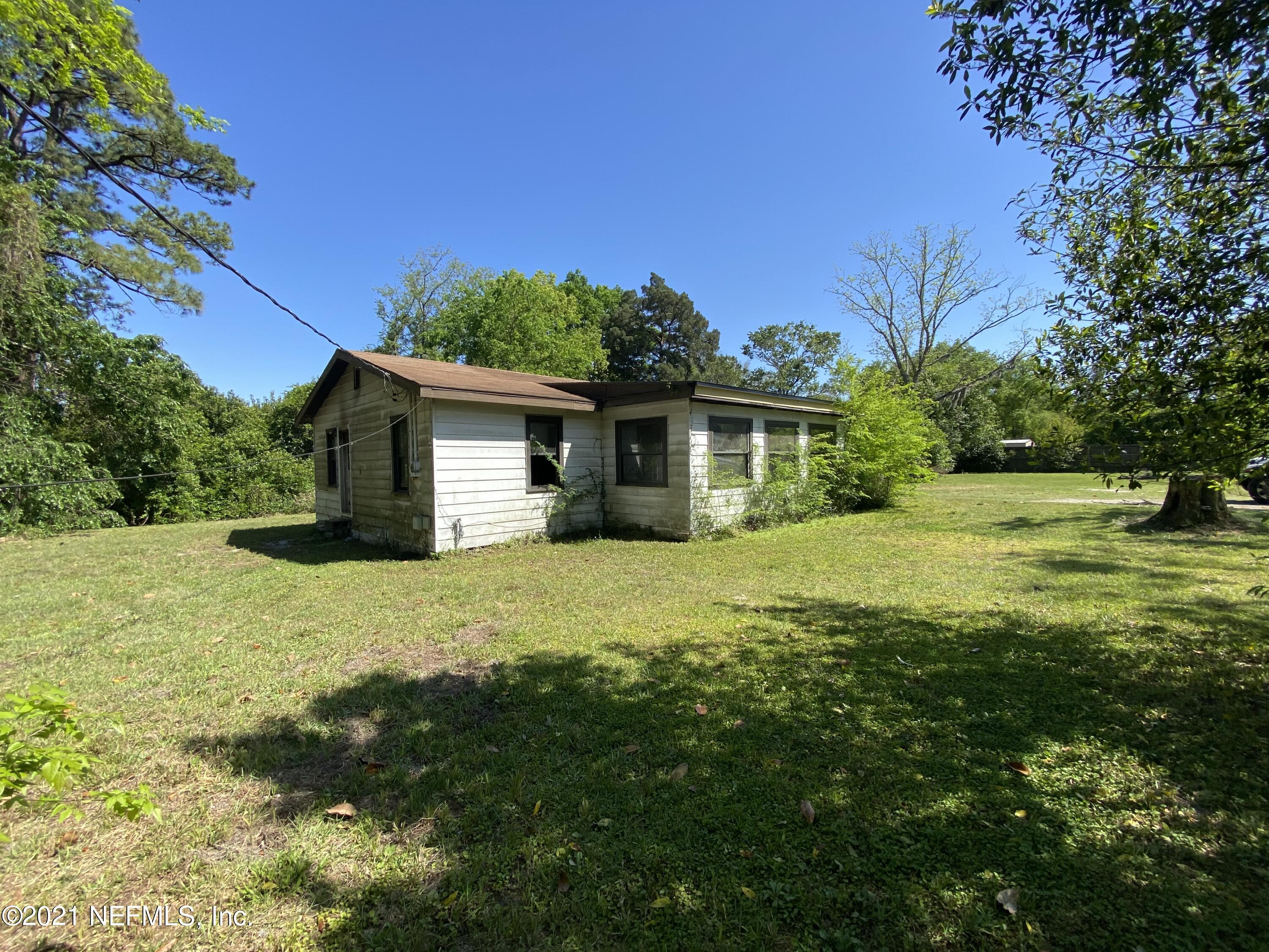 6427 Firestone Road Jacksonville, FL 32244 - Photo 40 of 55 a front view of a house with a yard