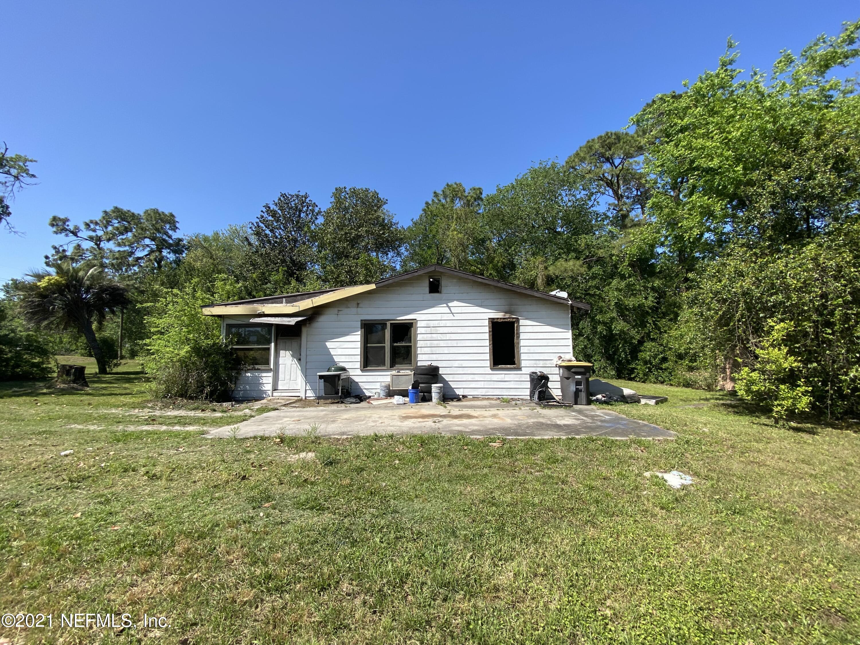 6427 Firestone Road Jacksonville, FL 32244 - Photo 41 of 55 a house with trees in the background