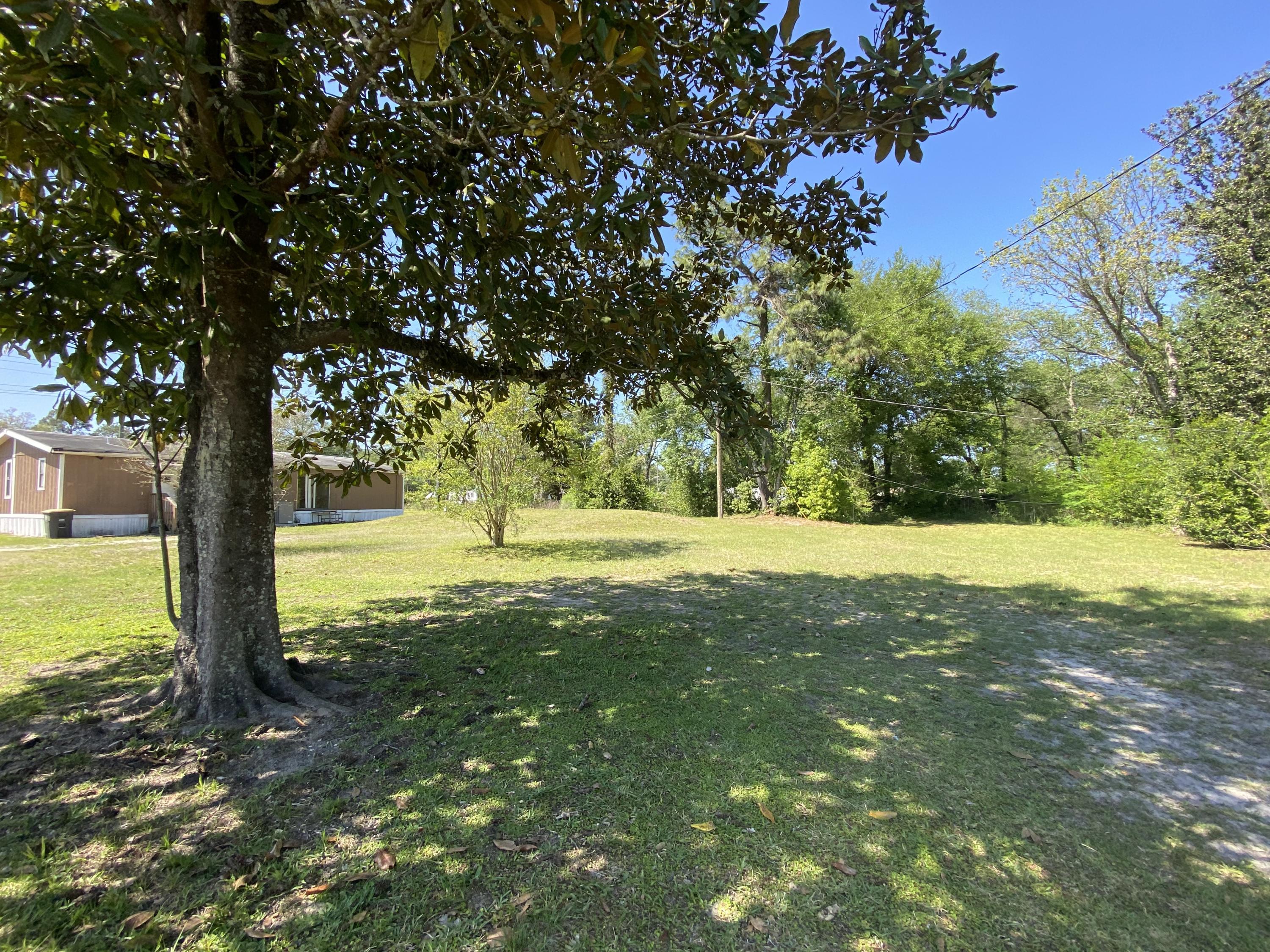 6427 Firestone Road Jacksonville, FL 32244 - Photo 50 of 55 a view of outdoor space with a garden