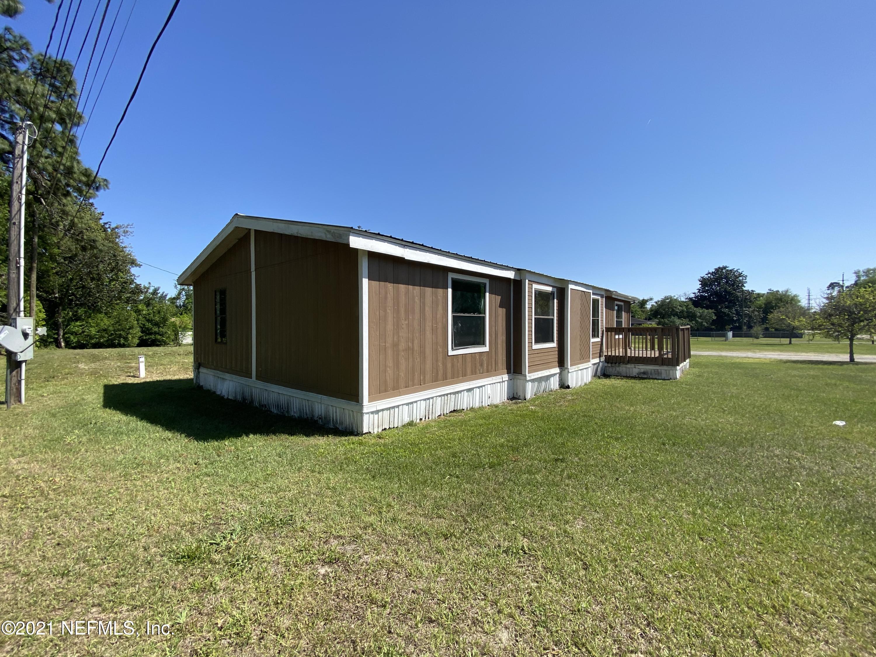 6427 Firestone Road Jacksonville, FL 32244 - Photo 6 of 55 a view of a back yard of the house