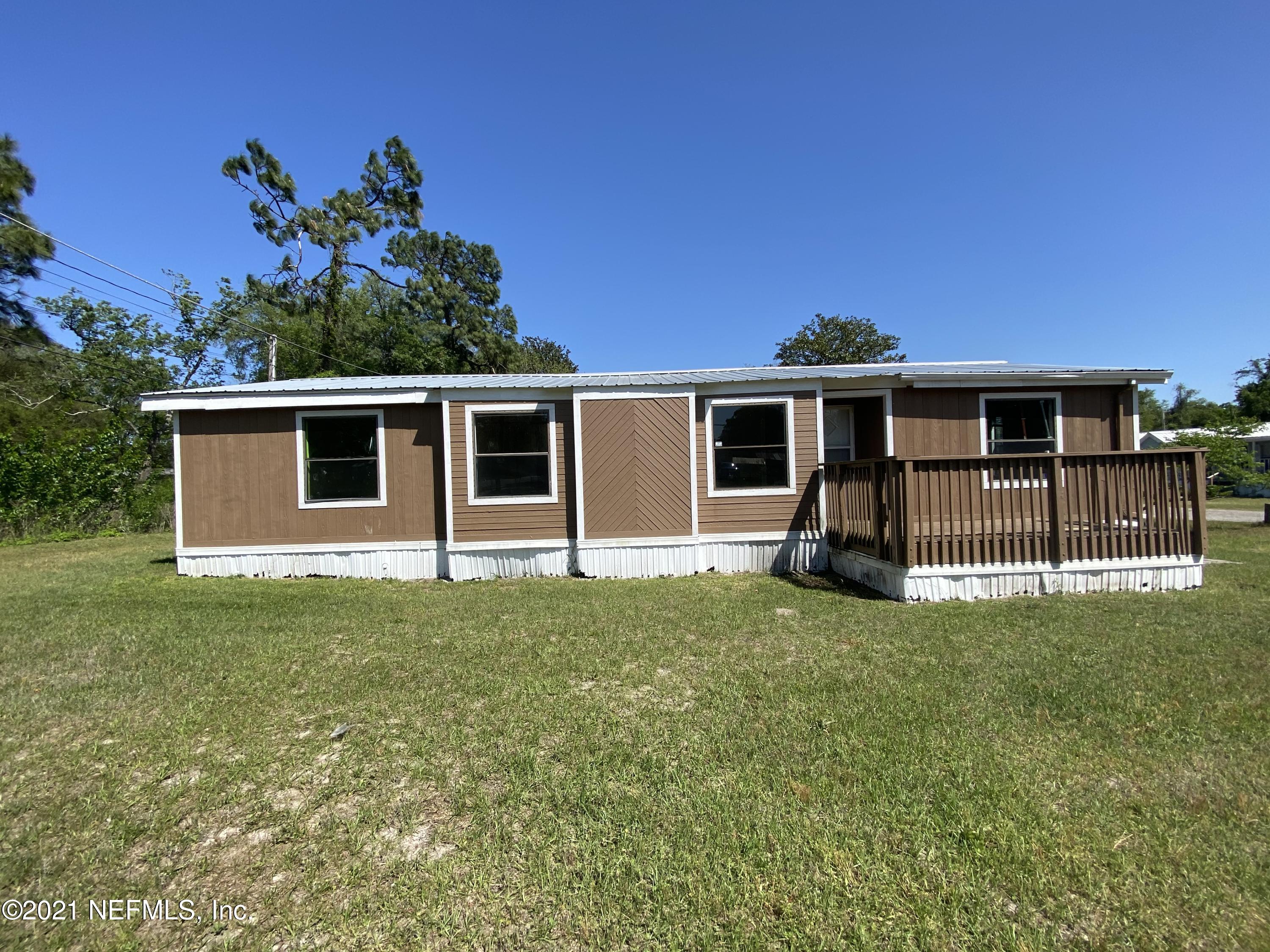 6427 Firestone Road Jacksonville, FL 32244 - Photo 7 of 55 a view of a house with a backyard