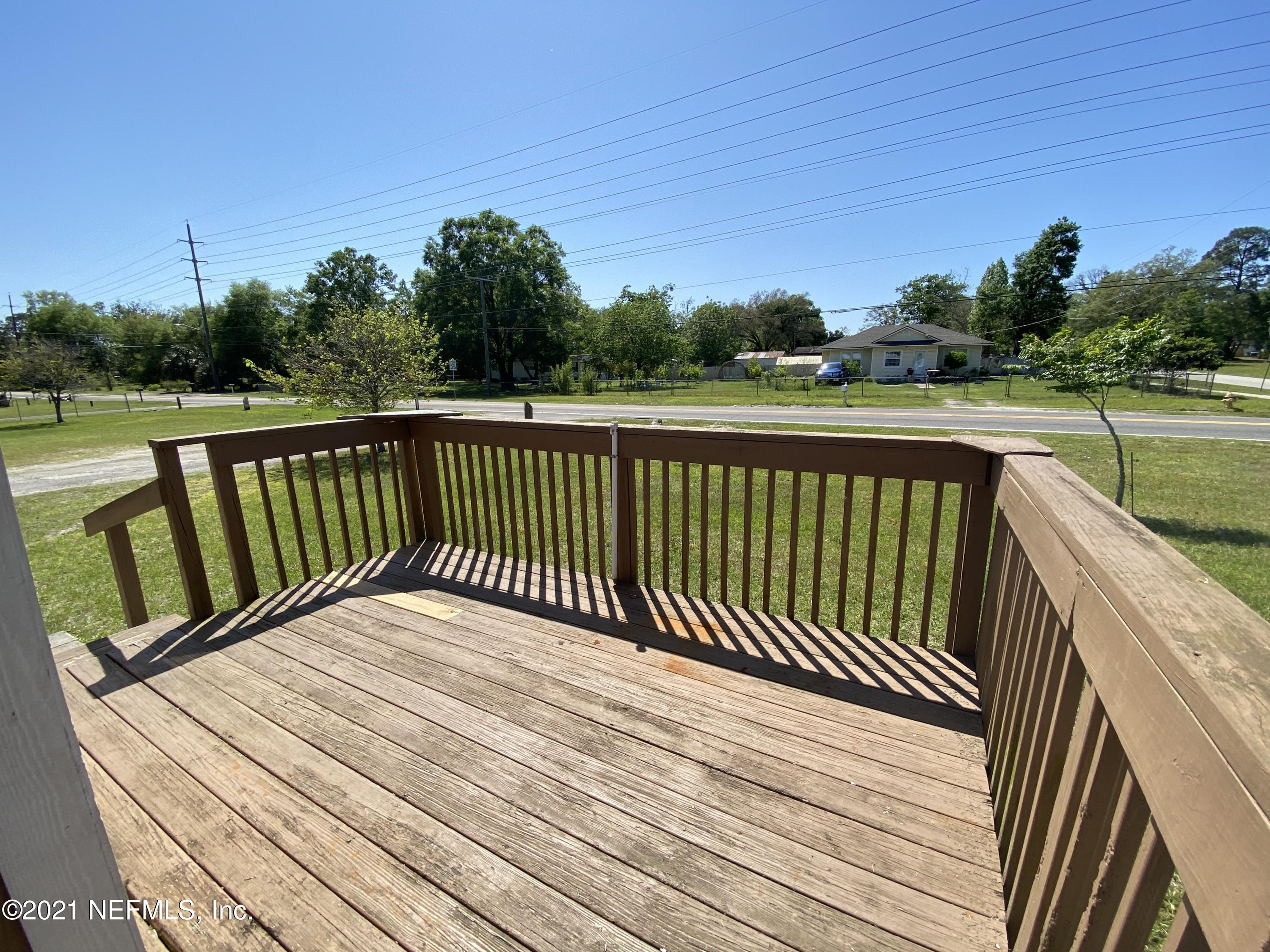 6427 Firestone Road Jacksonville, FL 32244 - Photo 10 of 55 a view of balcony with wooden floor and fence