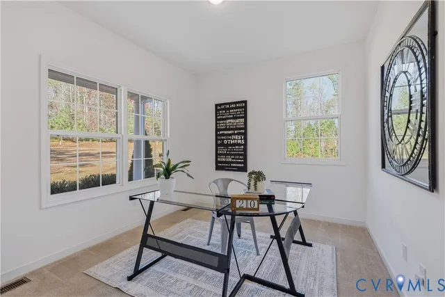 a workspace with furniture and a window