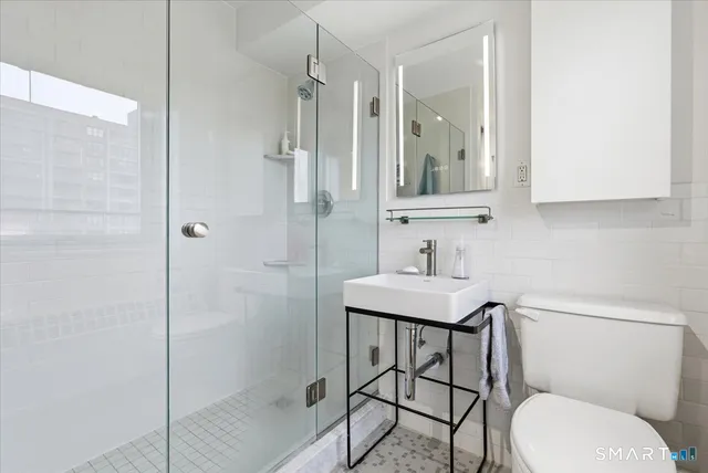 a bedroom with a bed chair and window