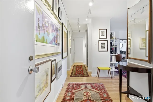 a living room with furniture and a rug
