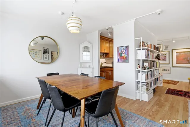 a view of a dining room with furniture and a window