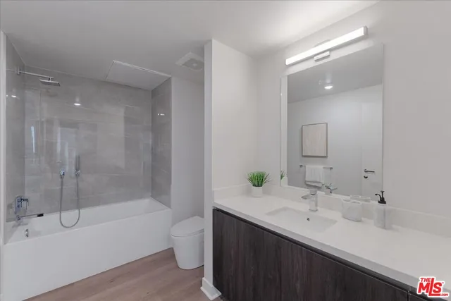 a bathroom with a double vanity sink mirror double and bathtub